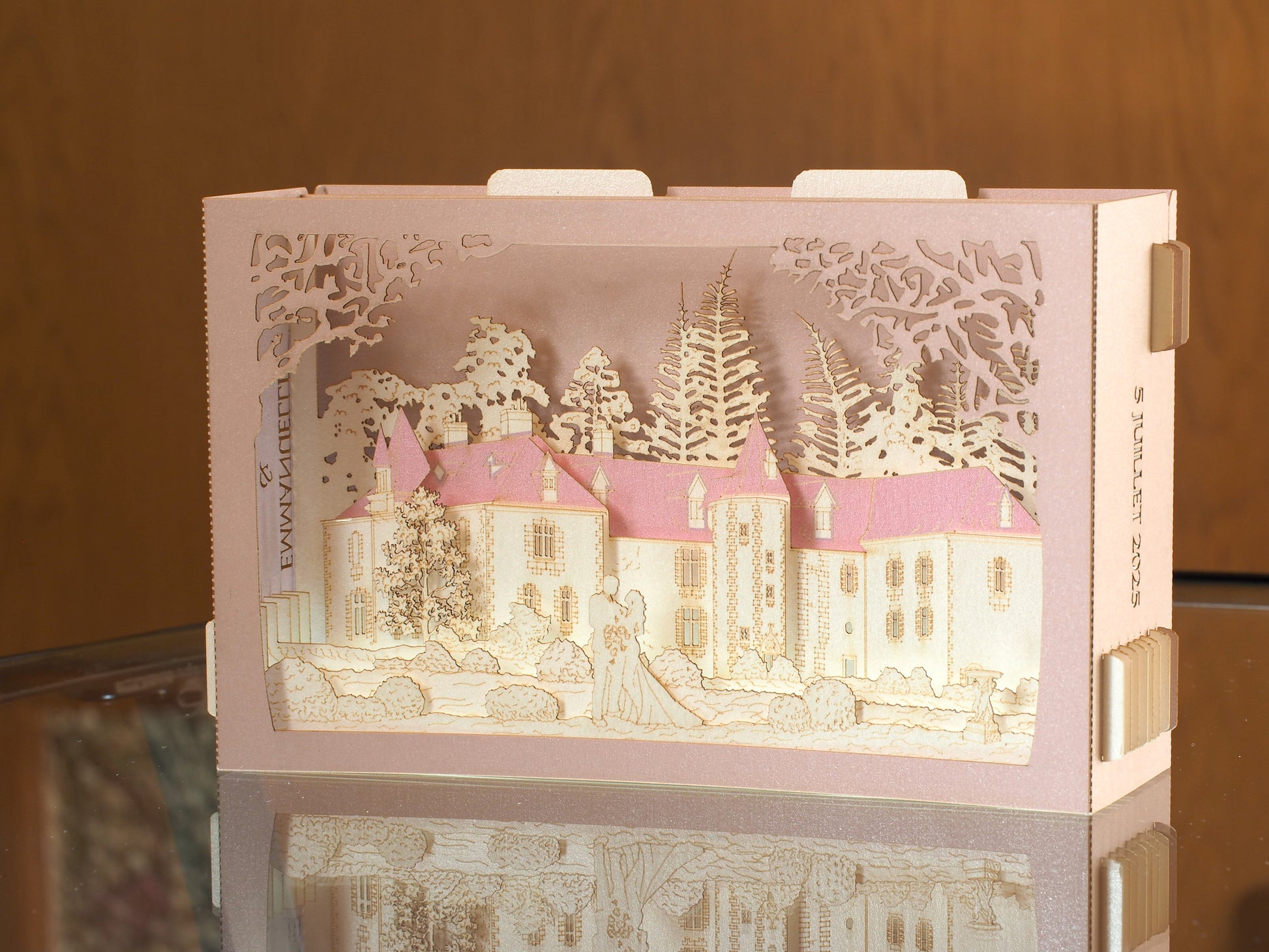 Pop up paper card with pink box and custom laser cut text, wedding invitation that folds flat and has layers inside. Design as a small architecture model of Chateau de Valesne France.