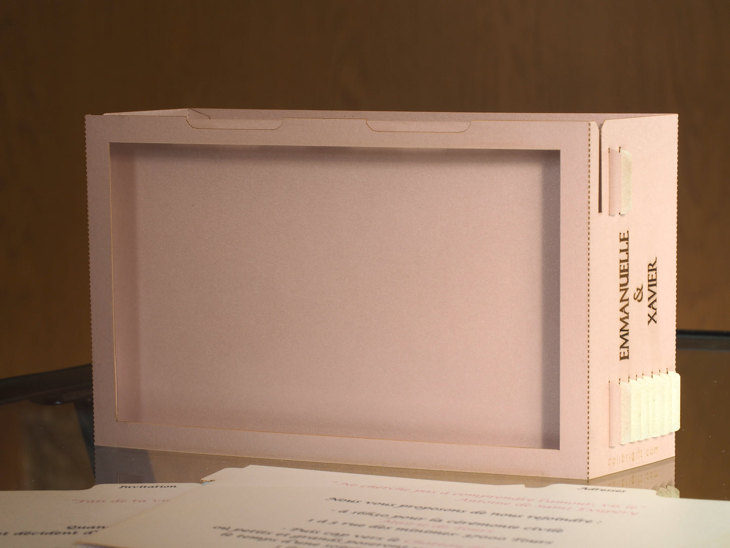Pop up paper card with pink box and custom laser cut text, wedding invitation that folds flat and has layers inside. Design as a small architecture model of Chateau de Valesne France.