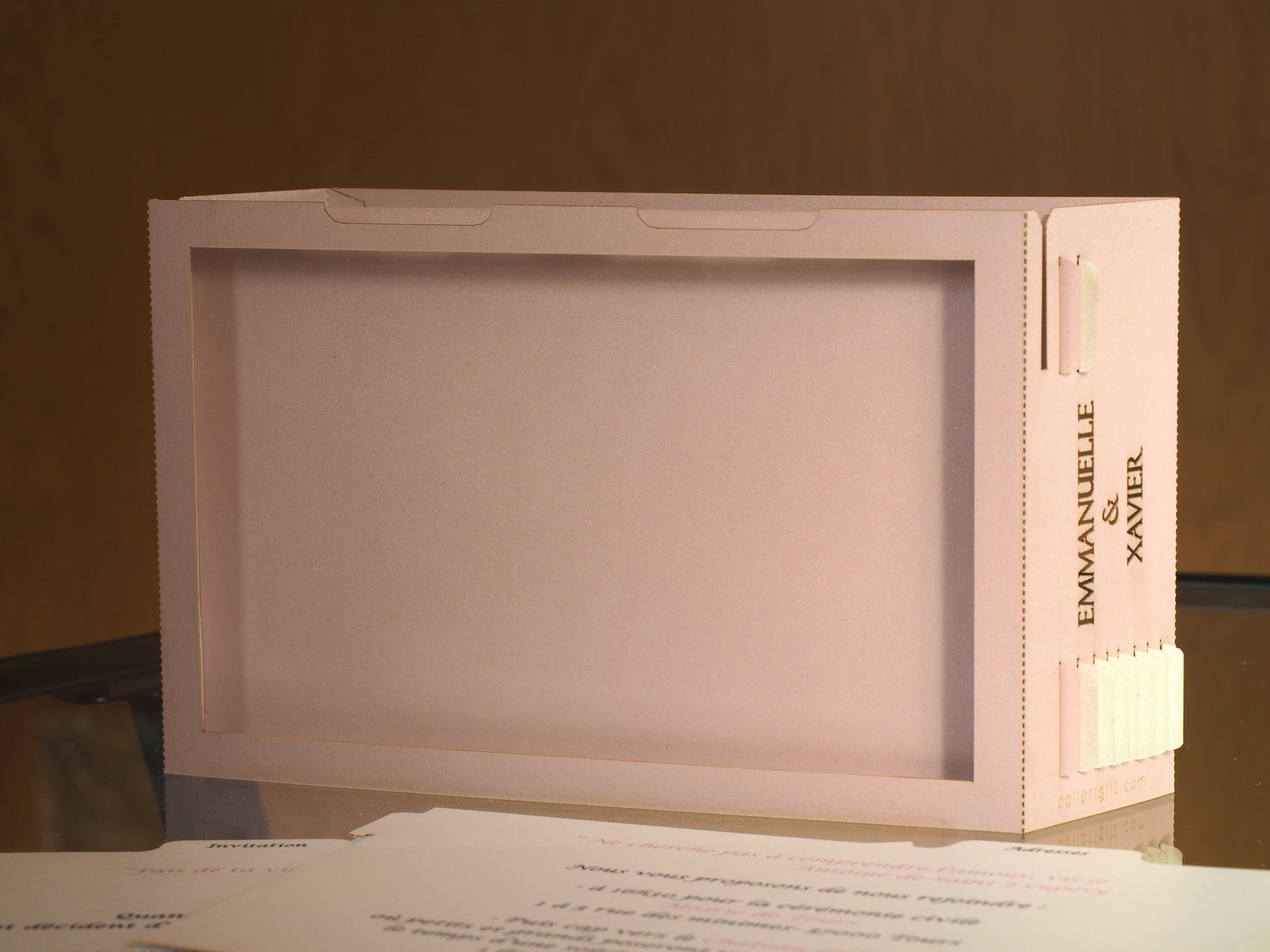 Pop up paper card with pink box and custom laser cut text, wedding invitation that folds flat and has layers inside. Design as a small architecture model of Chateau de Valesne France.