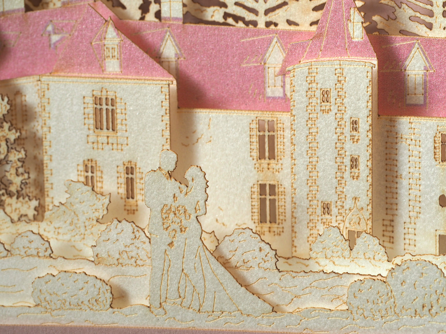 Pop up paper card with pink box and custom laser cut text, wedding invitation that folds flat and has layers inside. Design as a small architecture model of Chateau de Valesne France.