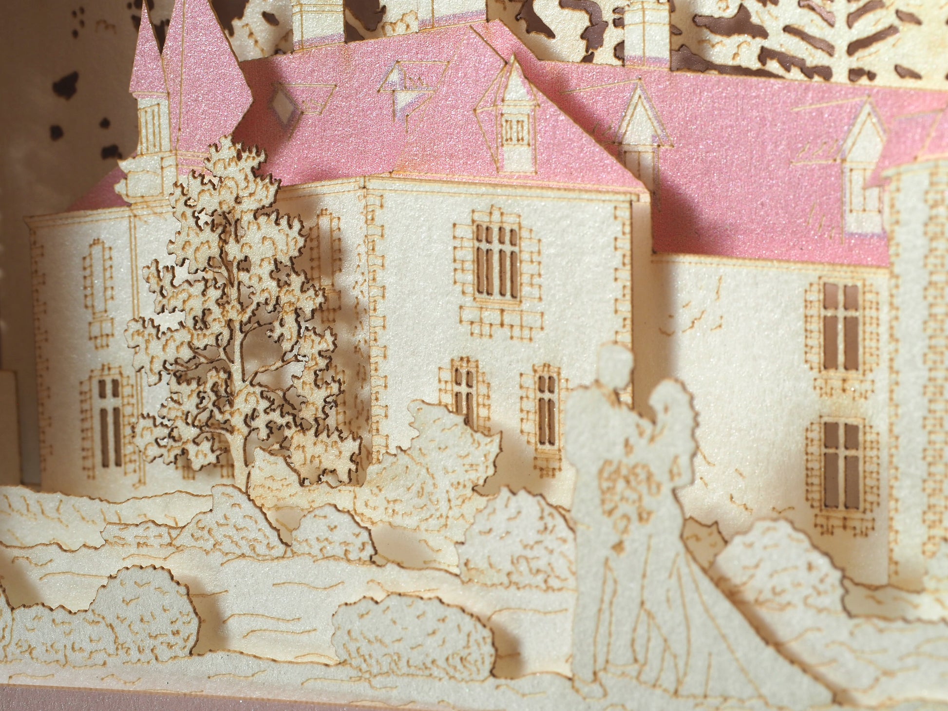 Pop up paper card with pink box and custom laser cut text, wedding invitation that folds flat and has layers inside. Design as a small architecture model of Chateau de Valesne France.