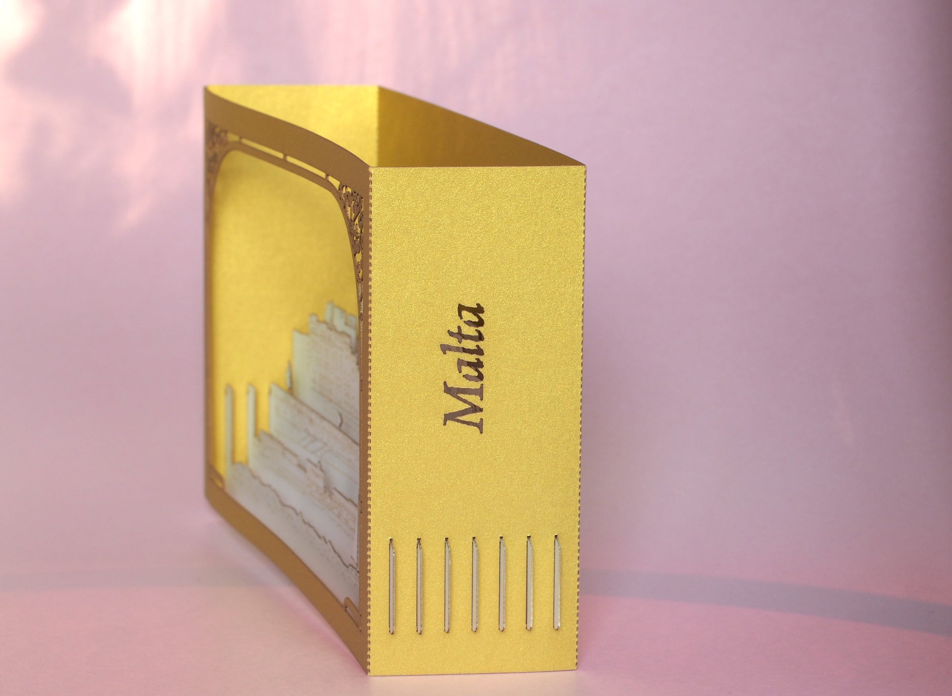 Paper 3d pop up card with Malta famous landmarks inside the box. Golden color paper box. Best gift idea for people who visited Malta as a souvenir