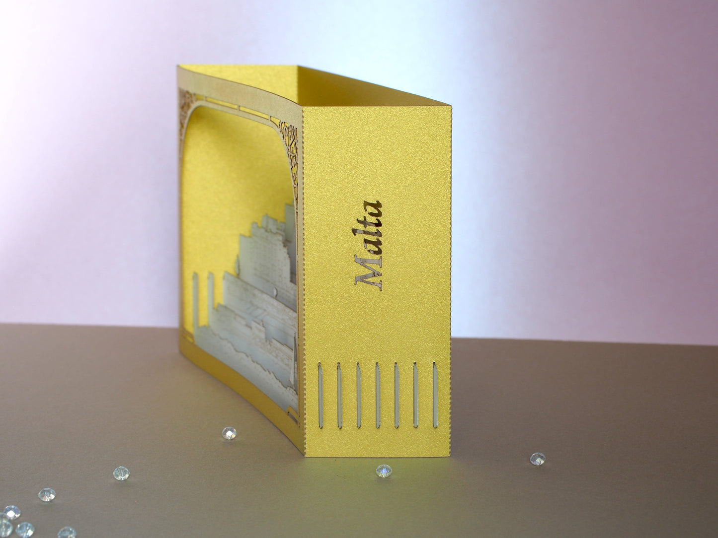 Paper 3d pop up card with Malta famous landmarks inside the box. Golden color paper box. Best gift idea for people who visited Malta as a souvenir