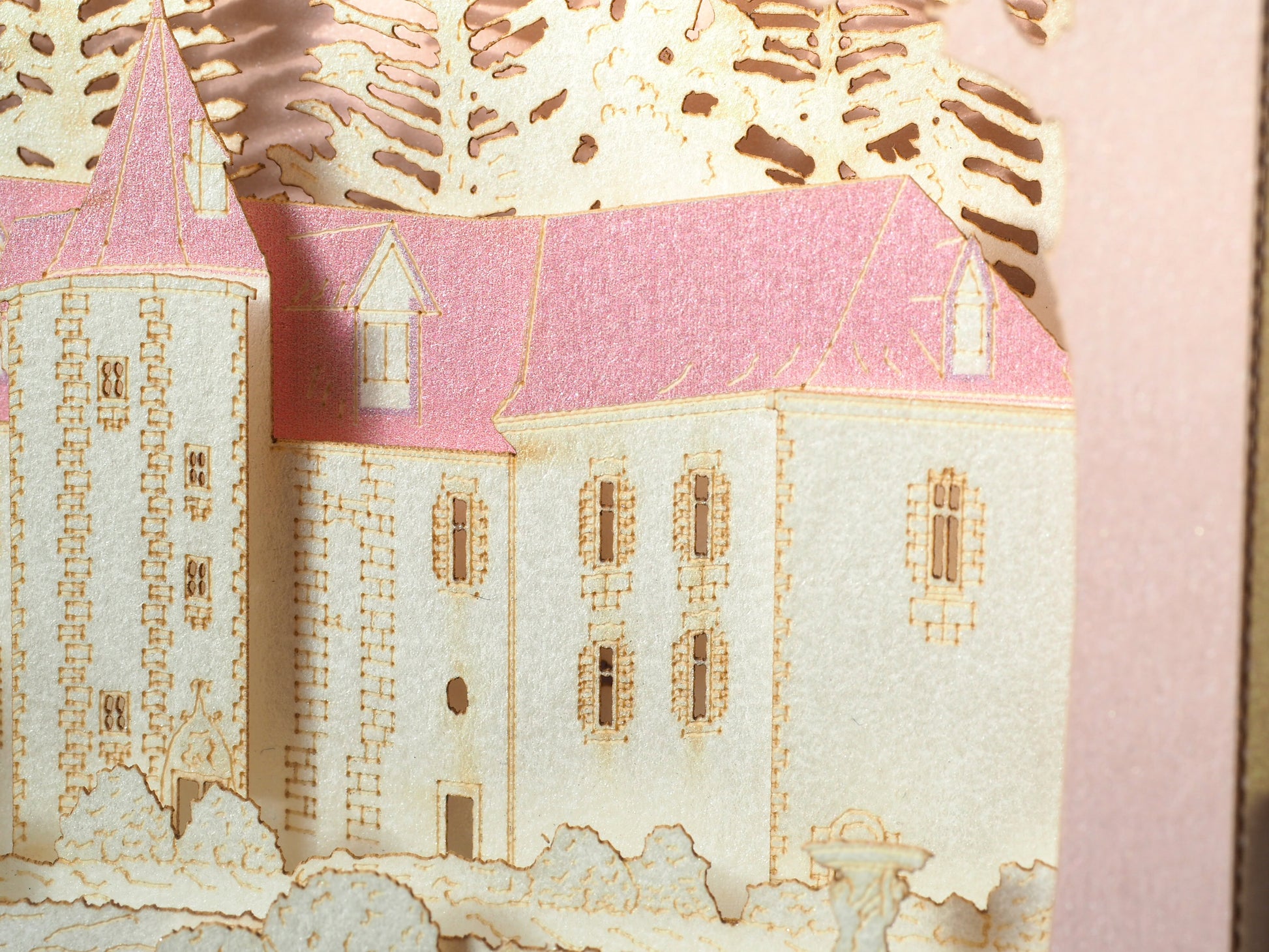 Pop up paper card with pink box and custom laser cut text, wedding invitation that folds flat and has layers inside. Design as a small architecture model of Chateau de Valesne France.