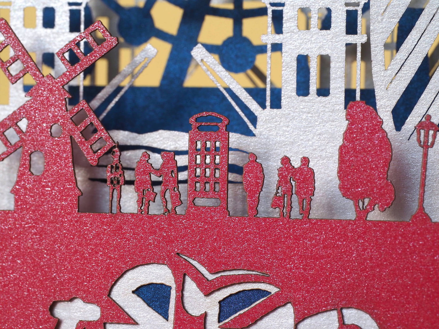 England flag. Paper pop up miniature. English Landmarks. Red Telephone, taxi, bus, Big Ben, Tower Bridge, The Needles, St Paul’s Cathedral