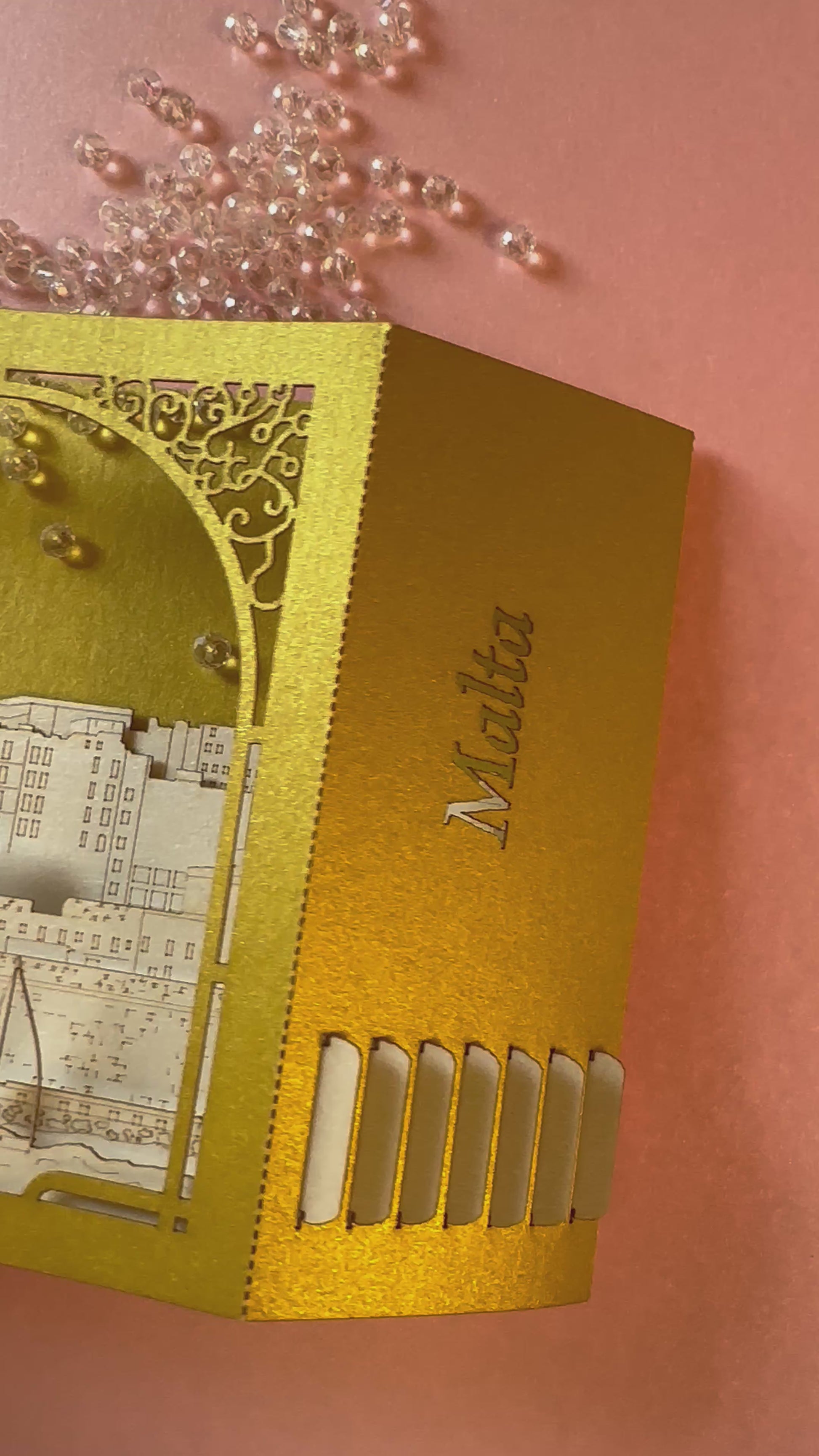 Paper 3d pop up card with Malta famous landmarks inside the box. Golden color paper box. Best gift idea for people who visited Malta as a souvenir