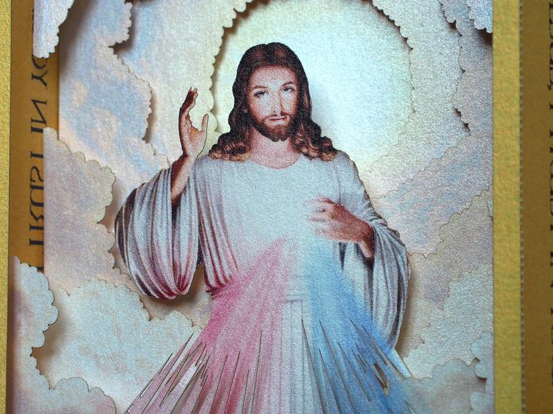 Divine Mercy (Catholic devotion) icon with Jesus - paper pop up card in gold color frame, two  rays- blue and red 