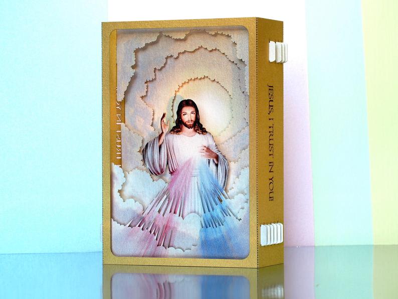 Divine Mercy (Catholic devotion) icon paper pop up card in gold color frame, two  rays- blue and red 