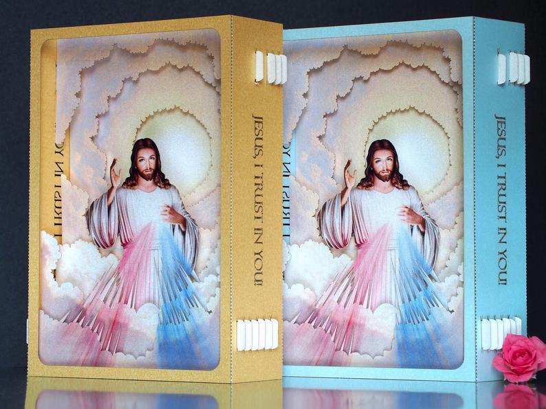 Divine Mercy (Catholic devotion) icon with Jesus - paper pop up card in gold color frame, two  rays- blue and red 