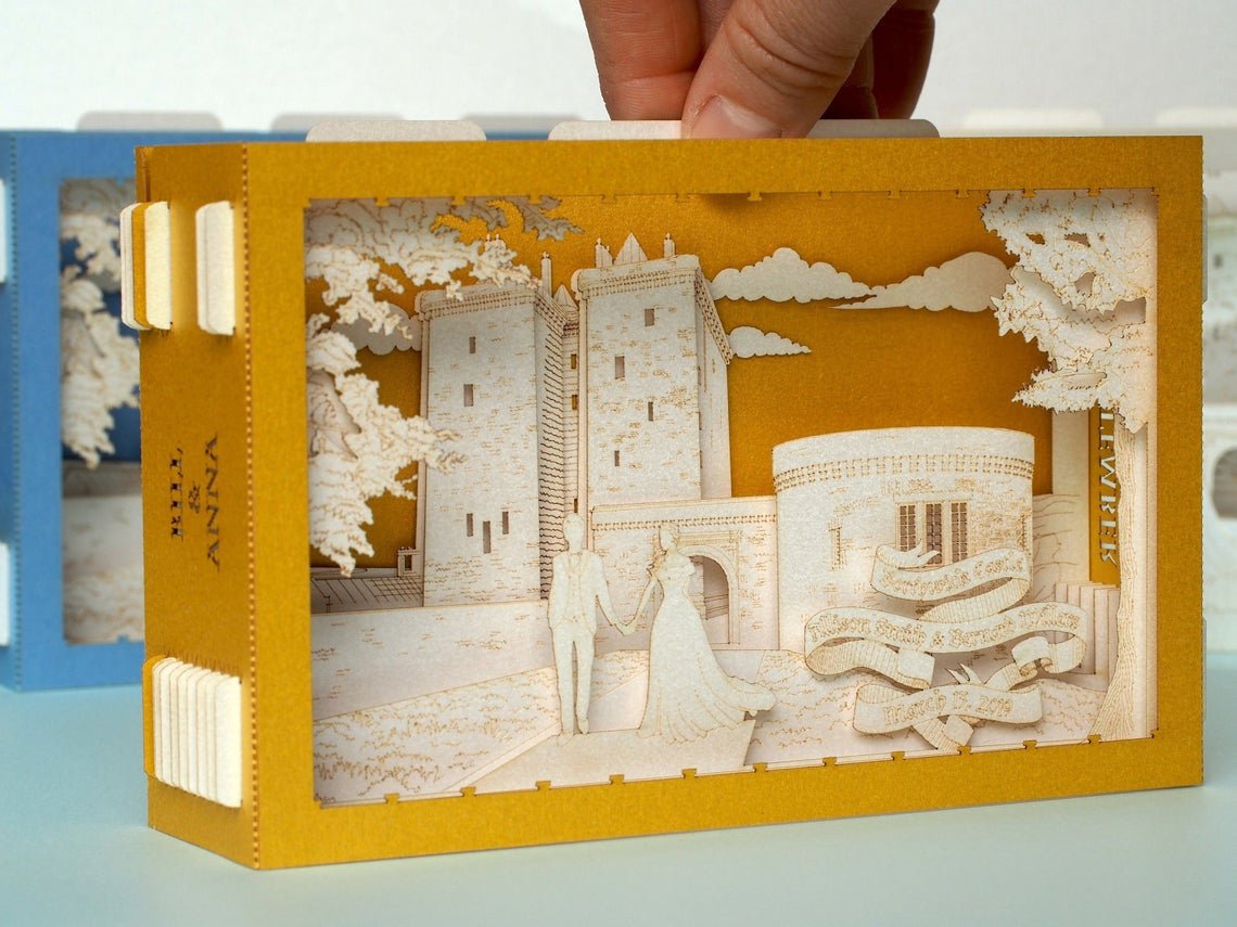 Box wedding invitation with Borthwick Castle and bride and groom